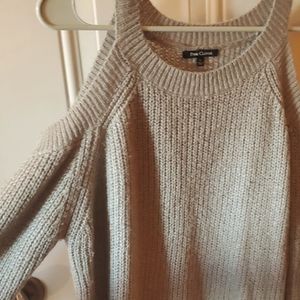 Off shoulder grey knit sweater.
